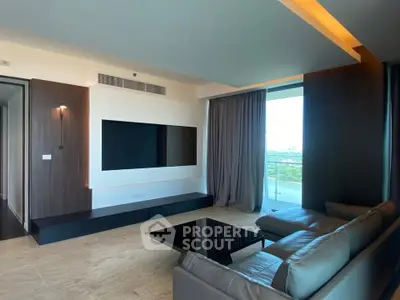 Luxurious modern living room with sleek design and stunning view from large windows.