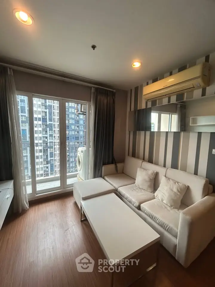 Modern living room with city view and air conditioning in high-rise apartment