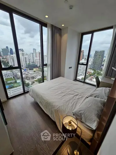 Modern bedroom with panoramic city view and stylish decor