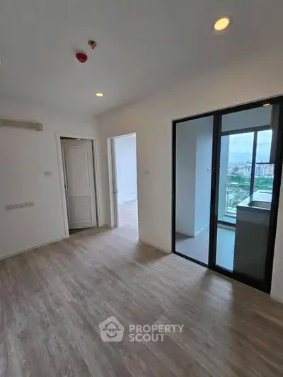 Modern apartment interior with balcony and city view