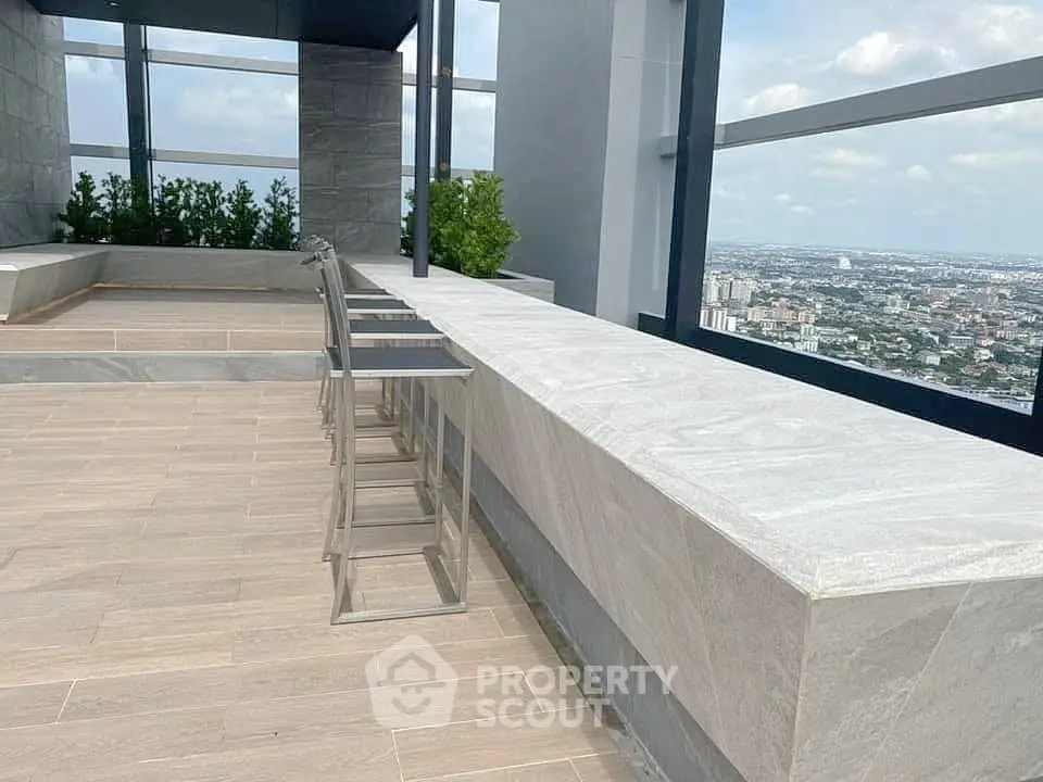 Stunning rooftop terrace with panoramic city views and modern seating area.