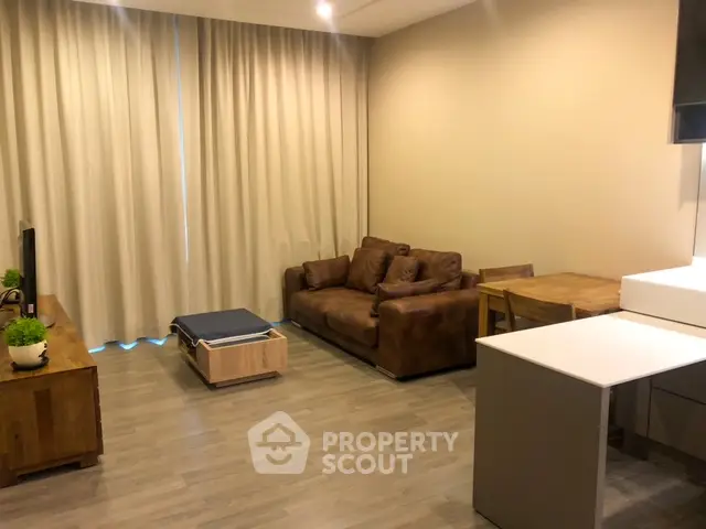 Modern living room with cozy brown sofa and wooden furniture