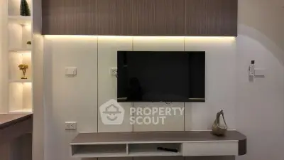 Modern living room with sleek TV unit and ambient lighting
