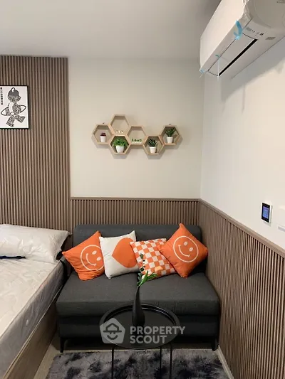 Cozy modern living room with stylish decor and air conditioning