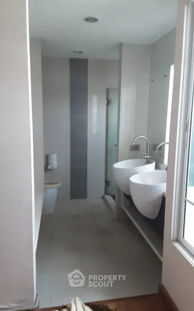 Modern bathroom with dual sinks and sleek design