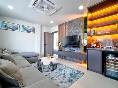 Modern living room with stylish decor and built-in shelving