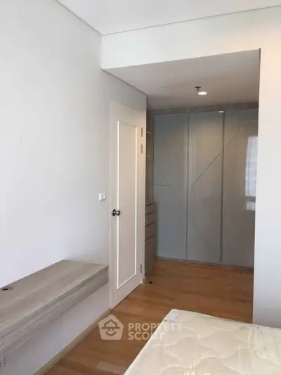 Modern bedroom with built-in wardrobe and minimalist design
