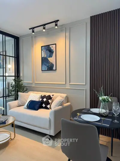 Stylish modern living room with elegant decor and cozy seating area.