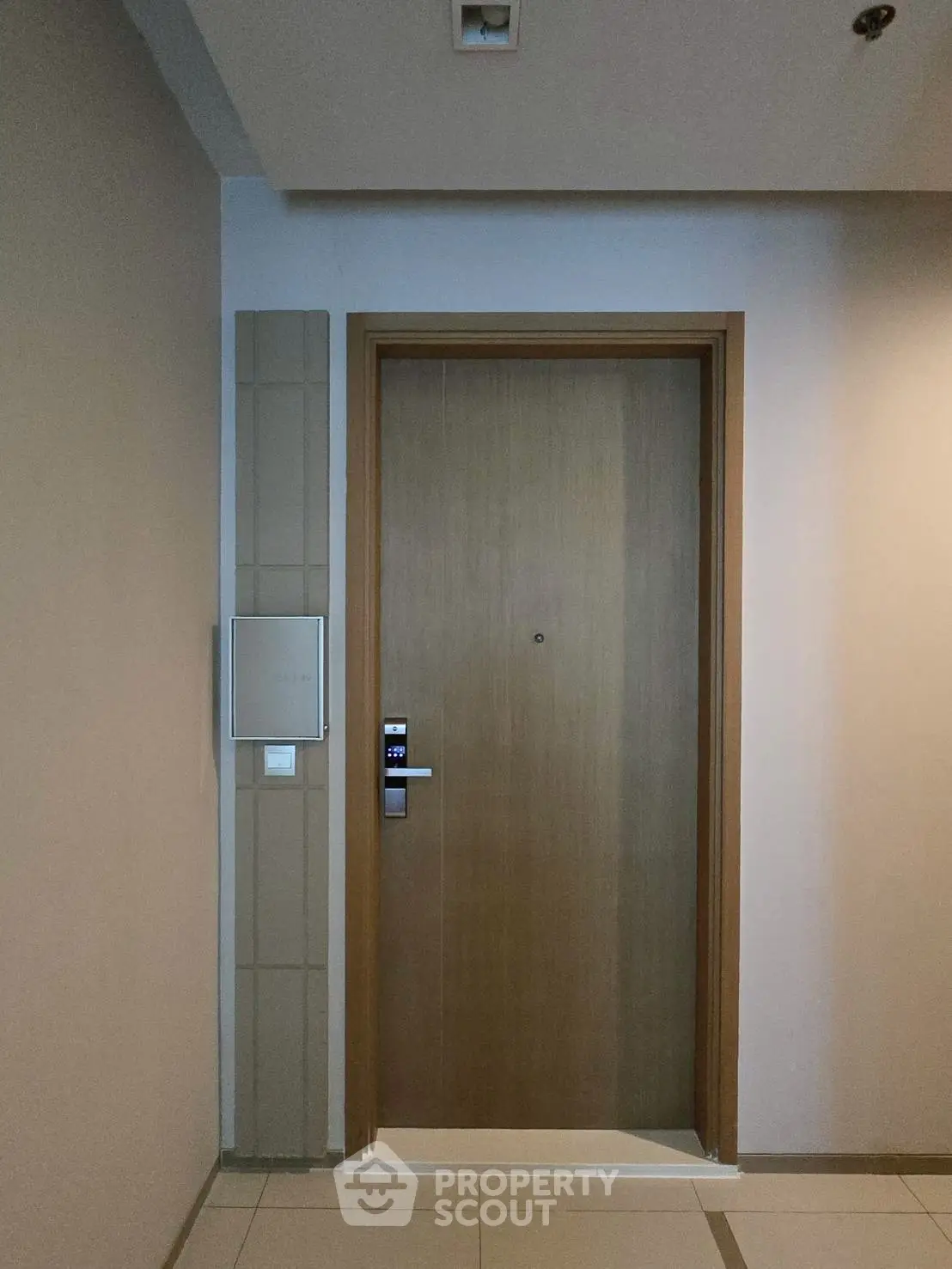 Modern apartment entrance with electronic lock and sleek design