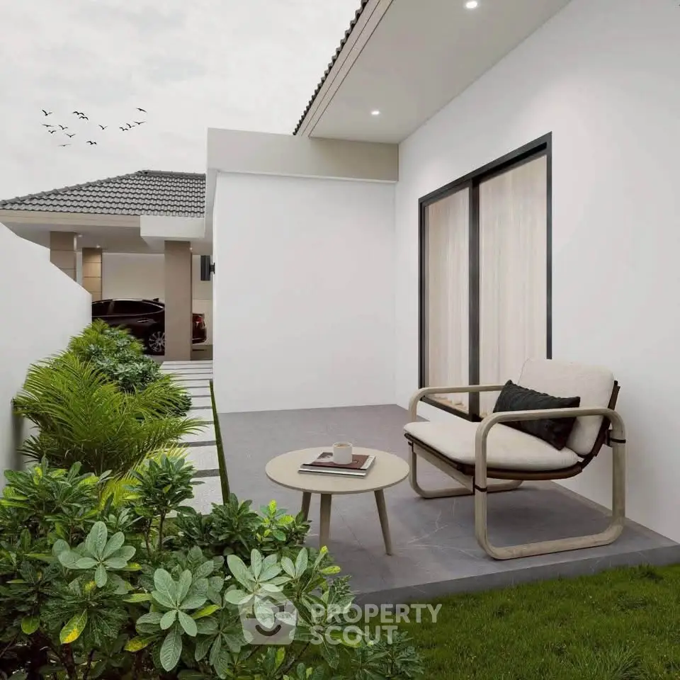 Modern patio with stylish outdoor furniture and lush greenery in a contemporary home setting.