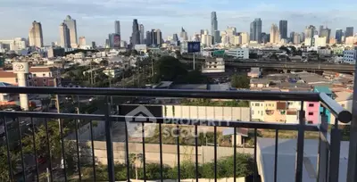 Stunning cityscape view from a high-rise balcony overlooking urban skyline.