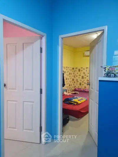 Vibrant interior with colorful walls and cozy bedroom view