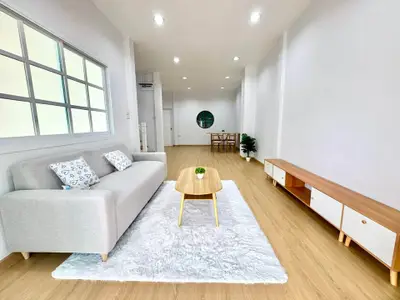 Spacious modern living room with stylish furniture and wooden flooring