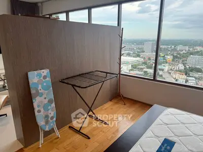 Spacious bedroom with stunning city view and modern furnishings