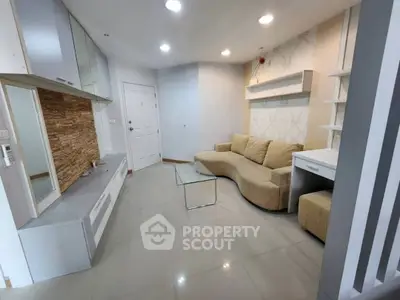 Modern living room with stylish sofa and glass coffee table