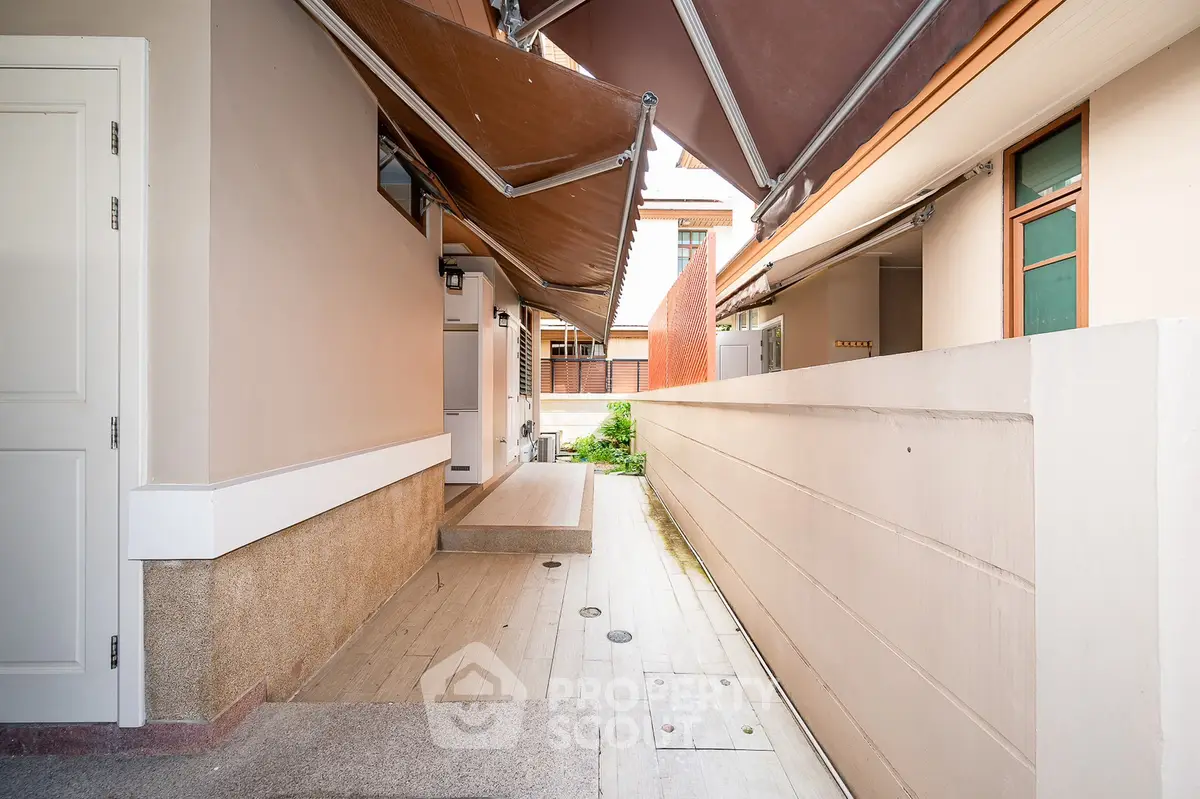 Modern exterior walkway with awning and sleek design elements