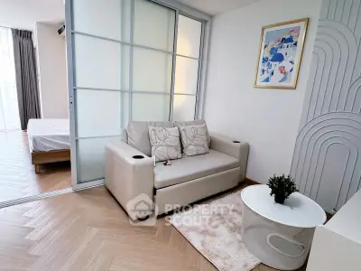 Modern living room with sliding glass doors and cozy decor