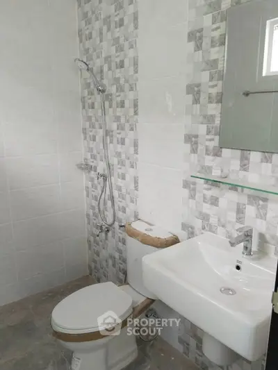 Modern bathroom with stylish tile design and sleek fixtures