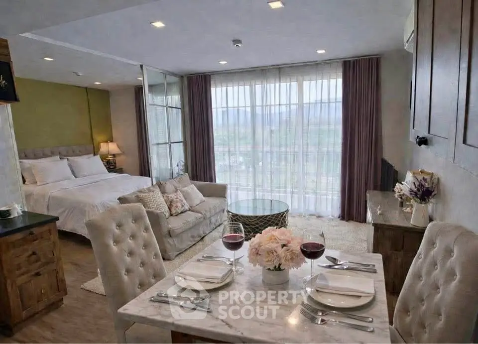 Luxurious open-plan living room with elegant dining area and scenic view, perfect for modern living.