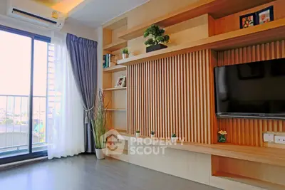 Modern living room with built-in wooden shelves and balcony view