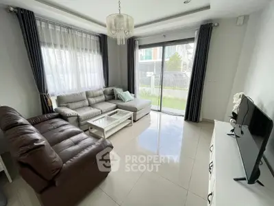 Spacious living room with modern decor and garden view