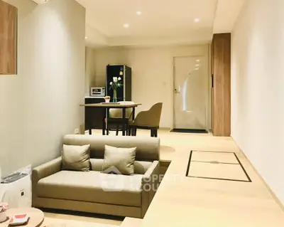 Modern living room with cozy sofa and dining area in elegant apartment