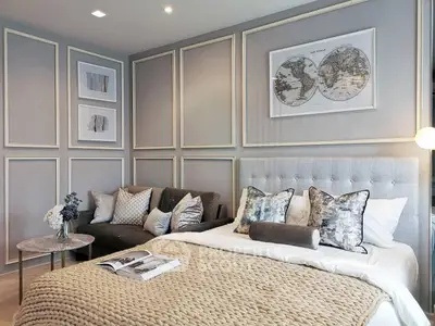 Luxurious bedroom with elegant decor and cozy seating area, perfect for relaxation and comfort.