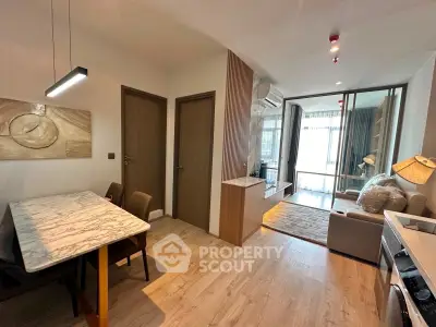 Modern living room with open layout and stylish decor in a contemporary apartment.
