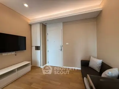 Modern living room with sleek design and wooden flooring