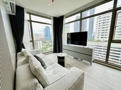 Modern living room with panoramic city views and stylish furnishings