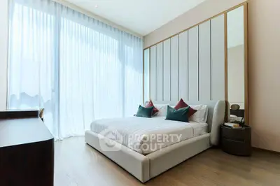 Luxurious bedroom with floor-to-ceiling windows and elegant decor