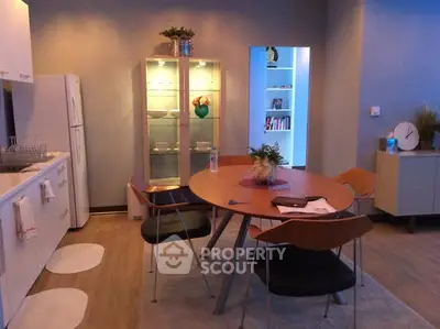 Modern kitchen with sleek dining area and stylish decor