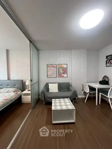 Modern studio apartment with cozy living area and stylish decor