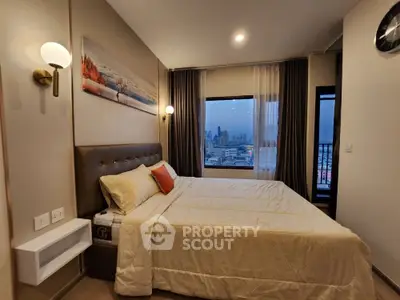 Modern bedroom with city view, featuring elegant decor and cozy lighting.