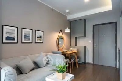 Modern living room with stylish decor and cozy seating area in a contemporary apartment.