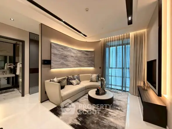 Luxurious modern living room with elegant decor and large windows.