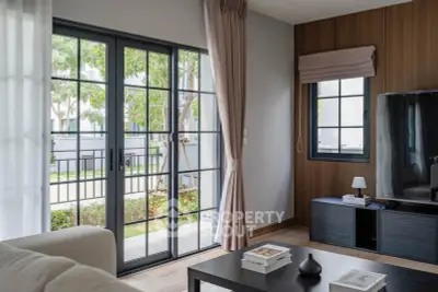 Modern living room with large windows and stylish decor