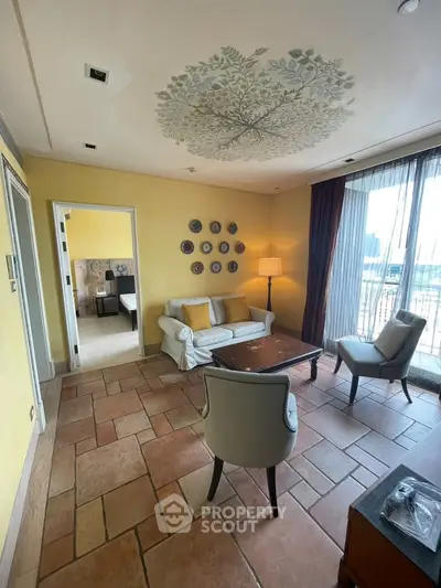 Charming living room with elegant decor and balcony view in a stylish apartment.