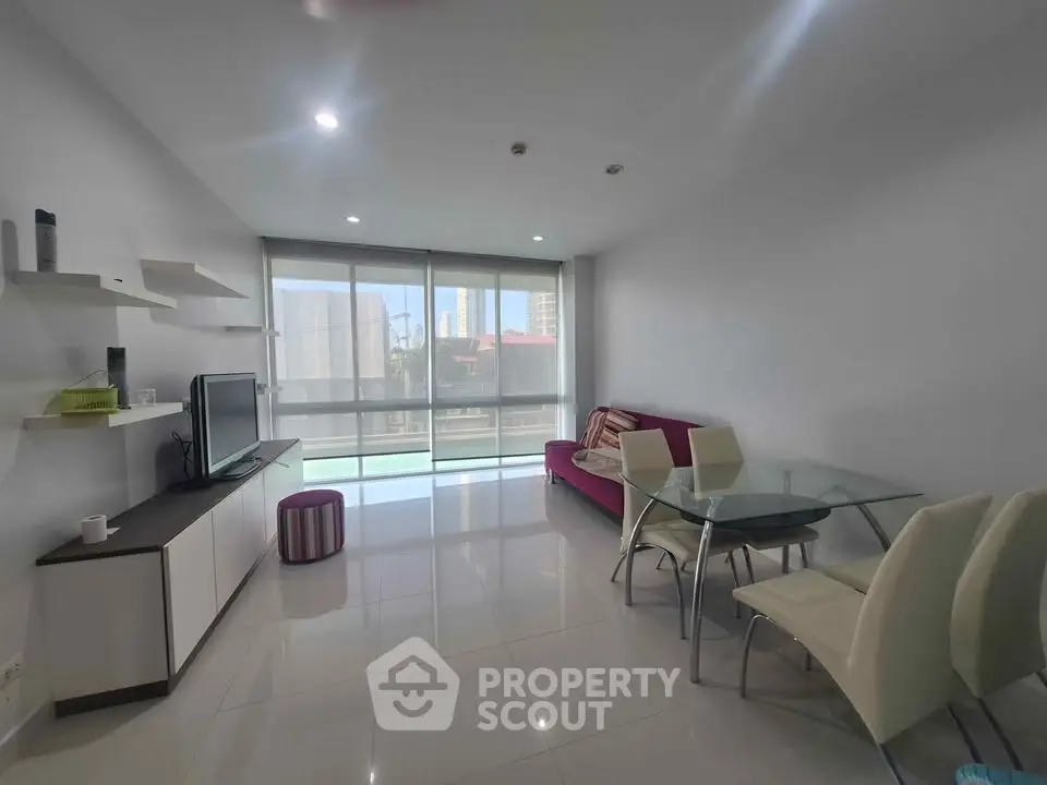 Spacious modern living room with sleek furniture and large windows