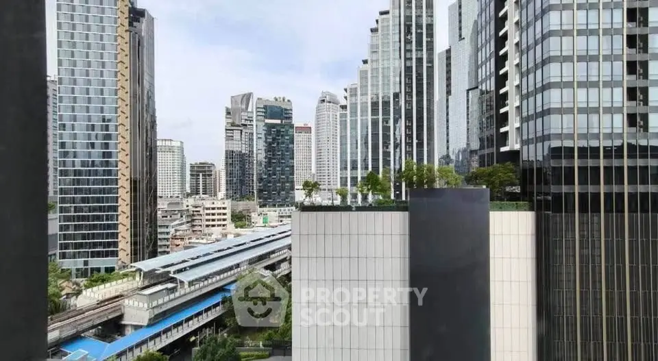 Stunning cityscape view from a high-rise building showcasing modern architecture and urban skyline.