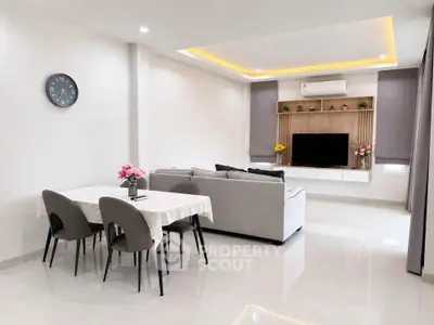 Modern living room with elegant dining area and stylish decor