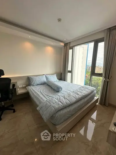Modern bedroom with large windows and scenic view in luxury apartment