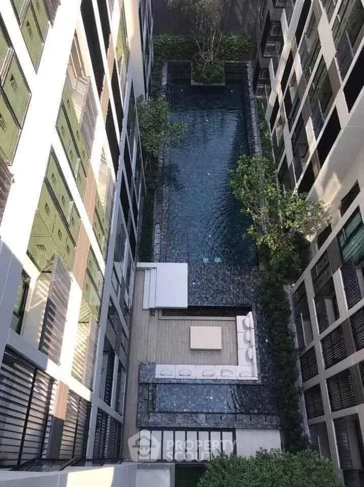Luxurious apartment complex with a stunning rooftop pool and modern design.