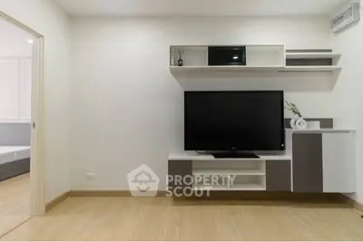 Modern living room with sleek TV unit and minimalist decor, perfect for contemporary living.