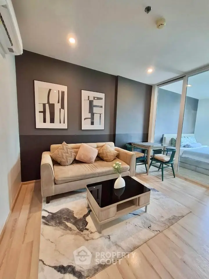 Modern living room with stylish decor and cozy seating in a contemporary apartment.