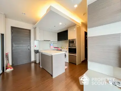 Modern kitchen with sleek cabinetry and integrated appliances in a stylish apartment