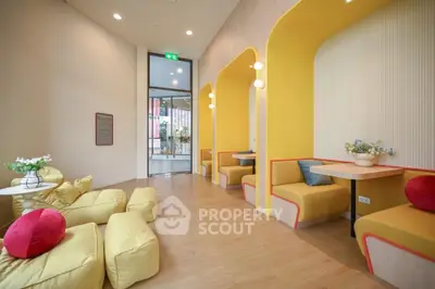 Modern lounge area with vibrant yellow seating and stylish decor