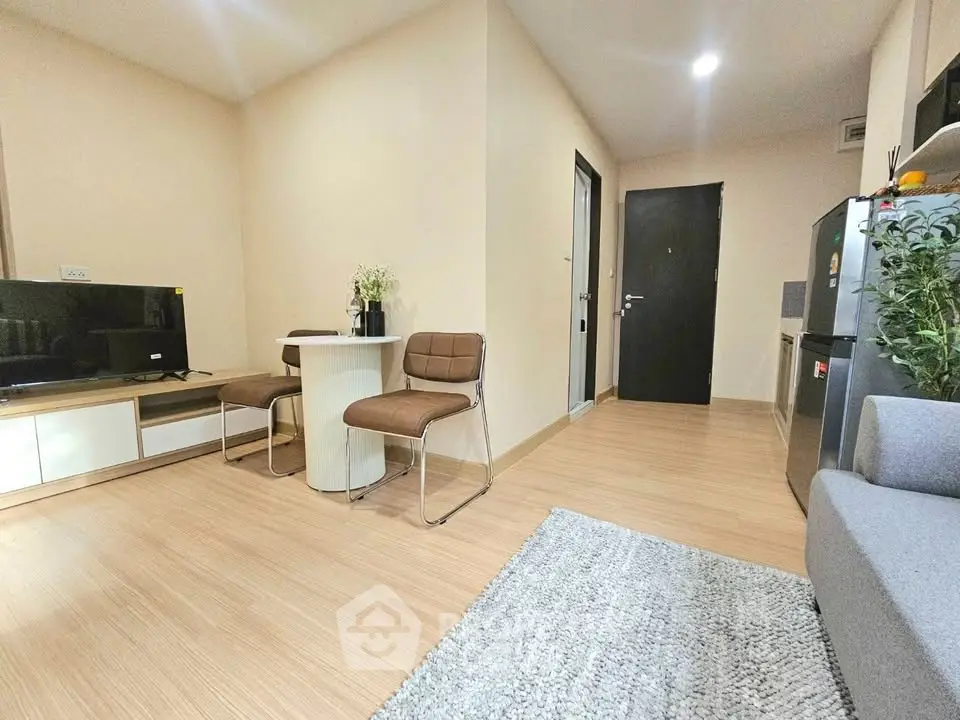 Modern living room with sleek furniture and open kitchen layout