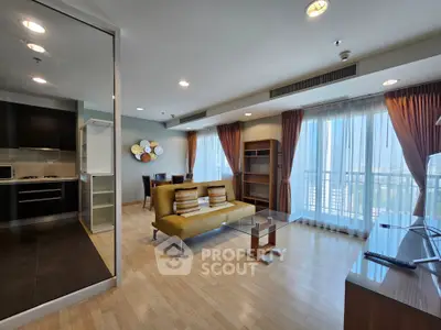 Spacious modern living room with open layout and large windows offering city views.