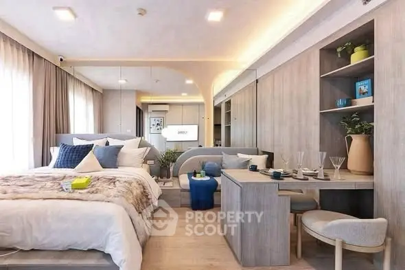 Modern studio apartment with stylish decor and open layout, featuring cozy bed and dining area.